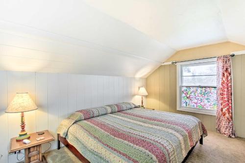 a bedroom with a bed and a window at Charming Eugene Vacation Home 1 Mi to Dtwn! in Eugene