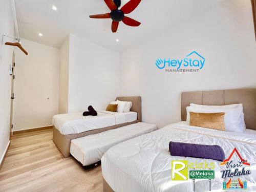 Katil atau katil-katil dalam bilik di Bali Residence Melaka By Heystay Management