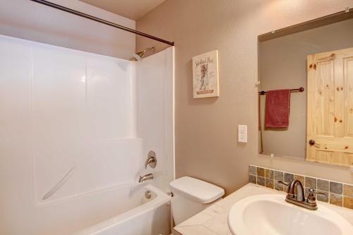 a bathroom with a sink and a toilet and a tub at Ronald Vacation Rental Near Suncadia Resort in Ronald