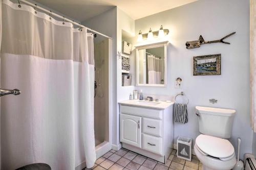 a bathroom with a white toilet and a sink at Westerly Vacation Home: Town Beach Access in Westerly