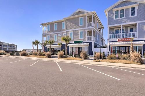 an empty parking lot in front of a building at Gorgeous Emerald Isle Getaway Walk to Beach! in Emerald Isle
