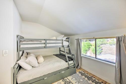 a bunk bed in a room with a window at Sagle Family Getaway Less Than 1 Mi to River and Beach in Sagle