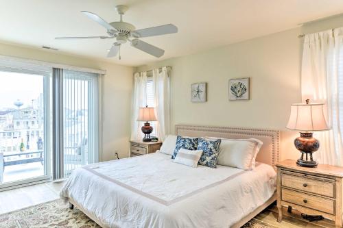 a bedroom with a bed and a ceiling fan at Sunny Brigantine Townhome Walk to Beach in Brigantine