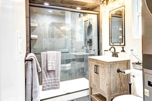 a bathroom with a shower and a sink at Hike, Fish and Explore California Cabin with Deck! in Long Barn
