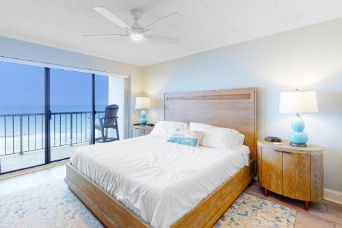 a bedroom with a large bed and a large window at Summer Beach 602 in Ocean City