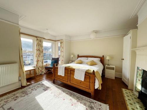 a bedroom with a bed and a large window at The Anchorage , Gorleston on Sea in Gorleston-on-Sea