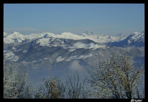 a view of a mountain range with snow covered mountains at Hotel Ristorante Costa in Costa Valle Imagna