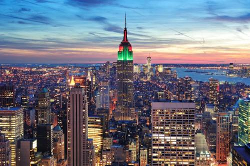 a view of the empire state building at night at voco Times Square South New York by IHG in New York