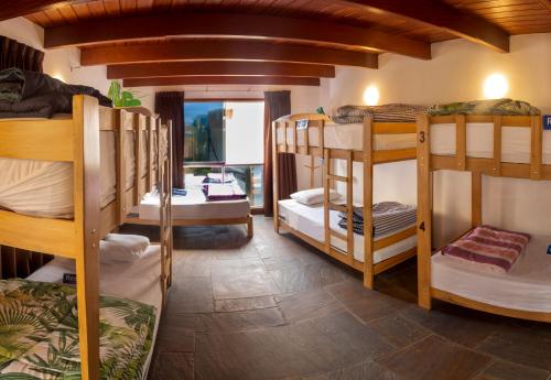 a room with a bunch of bunk beds at Rainbow Hostel in Lima
