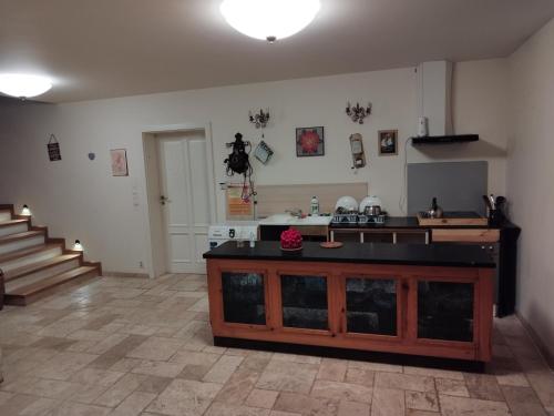 a kitchen with a counter in a room with stairs at Twój Azyl in Świdnik