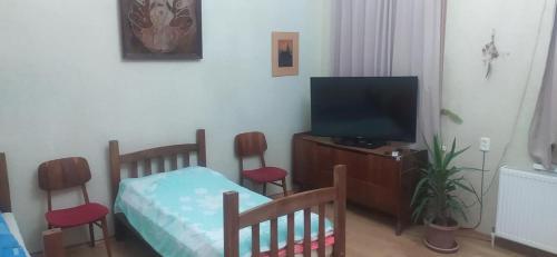 Postel nebo postele na pokoji v ubytování GEO Vake Guest House