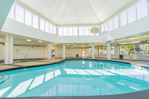 a large swimming pool with a large ceiling at Plantation East #1104 in Gulf Highlands