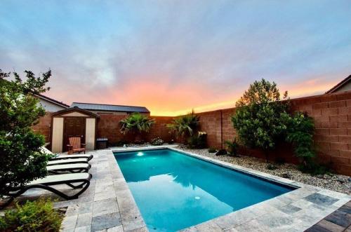 a swimming pool in the backyard of a house at Sand Hollow 3334 BBQ Grill, Private Splash Pad, Hot tub and Pool in Hurricane