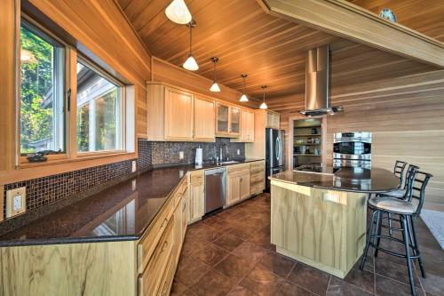 a kitchen with wooden cabinets and a counter top at Marrowstone Island Home 20 Mins to Port Townsend! in Nordland