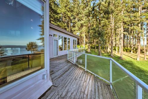 a balcony with a view of a house at Marrowstone Island Home 20 Mins to Port Townsend! in Nordland