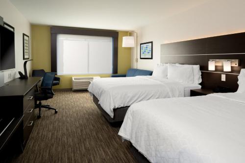 a hotel room with two beds and a television at Holiday Inn Express & Suites - Bullhead City by IHG in Bullhead City