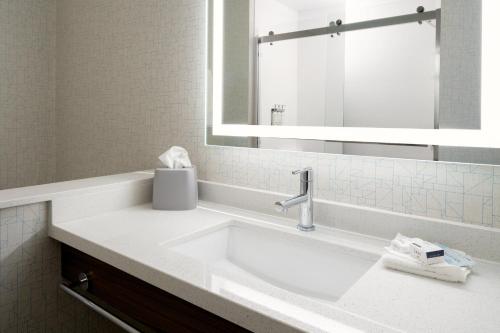 a bathroom with a sink and a mirror at Holiday Inn Express & Suites - Bullhead City by IHG in Bullhead City