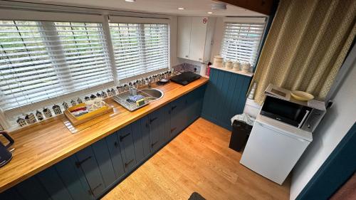 an overhead view of a kitchen with a sink and a refrigerator at Toosey Lass - St Osyth creek in Saint Osyth