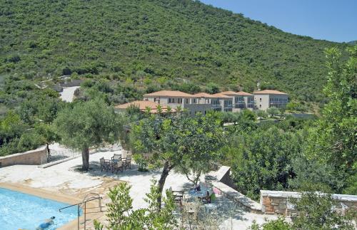 an aerial view of a resort with a swimming pool at Smyros Resort in Poúlithra