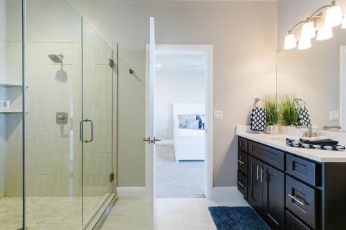 a bathroom with a glass shower and a sink at Zion Village Resort 2102 Community Pool, Ping Pong table, and near Zion National Park in Hurricane