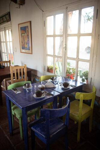 a dining room table with bowls and plates on it at Tampu in Cachí