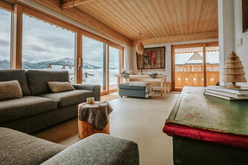 a living room with a couch and a table at SOPA Zakopane in Zakopane