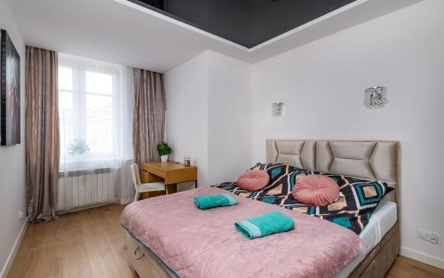 Posteľ alebo postele v izbe v ubytovaní Waryńskiego Jacuzzi FamilyRoom