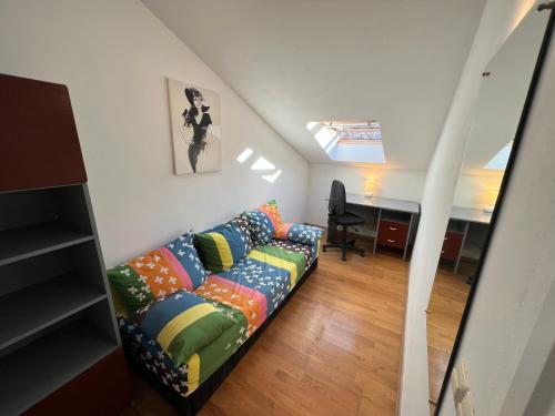 a living room with a couch with colorful pillows at Biljana Ivanisevic Apartments in Jelsa