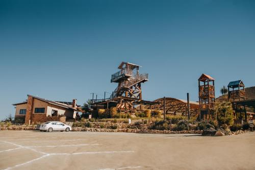 a car parked in a parking lot in front of a building at Finca el Mirador in Valle de Guadalupe