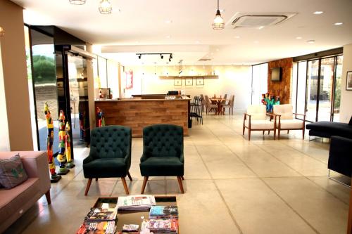 a lobby of a store with chairs and tables at Imperial Hotel By Nobile in Juazeiro do Norte