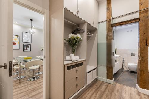 a bathroom with a toilet and a sink at BNBHolder Living LA LATINA in Madrid