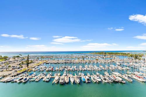 an aerial view of a marina with boats in the water at Stunning 1BR Ocean View Condo at Ilikai Marina in Honolulu