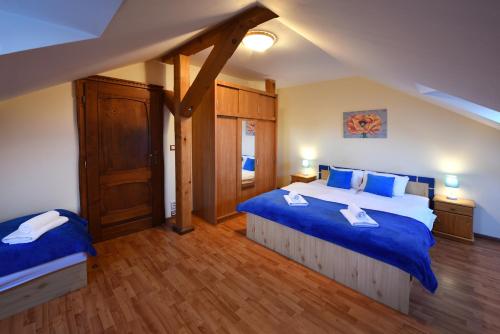 A bed or beds in a room at Penzión Víchrica