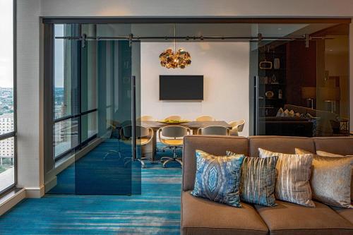 a living room with a couch and a table at The Westin Galleria Houston in Houston