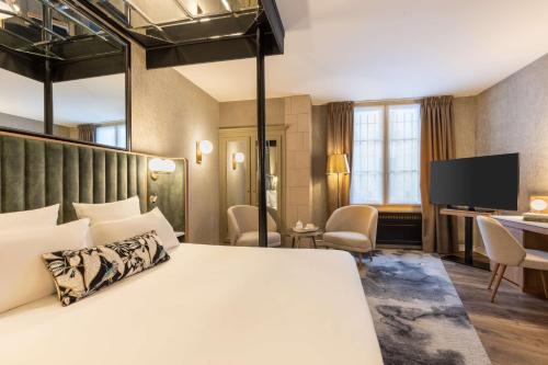 Postel nebo postele na pokoji v ubytování Best Western Saint-Louis - Grand Paris - Vincennes