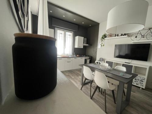 a kitchen and dining room with a table and chairs at Appartamenti Mar y Sol in Gabicce Mare