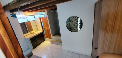 a view of a bathroom from the hallway of a house at Palmitas Apartment in Puerto Vallarta