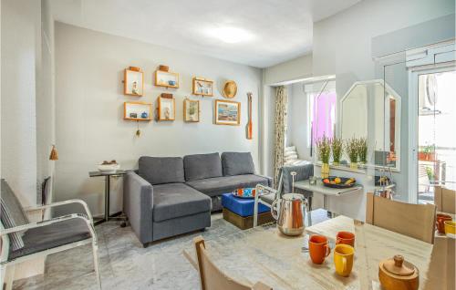 a living room with a couch and a table at Beautiful Apartment In Santa Pola in Santa Pola