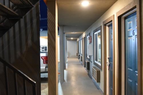 an empty hallway of an apartment building with a hallway at Town Place Studio in Snyder