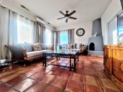 a living room with a couch and a table at LUX 3 MASTER BDROOM ON SANDY BEACH w NO CLEAINING FEE in Puerto Peñasco