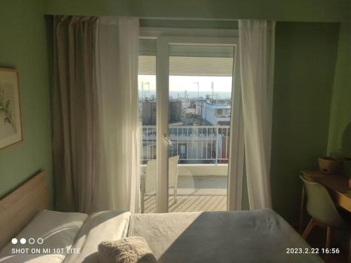 Ένα ή περισσότερα κρεβάτια σε δωμάτιο στο Aigli sea view