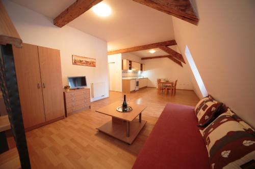 a living room with a couch and a table at Chateau Diva in Turčianske Teplice