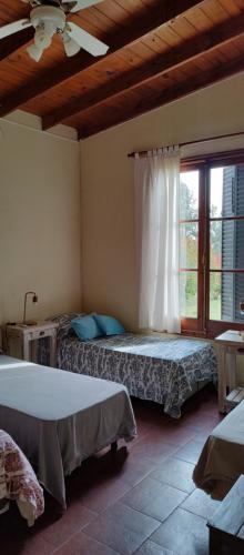 Een bed of bedden in een kamer bij Casa rural El Encuentro vagues