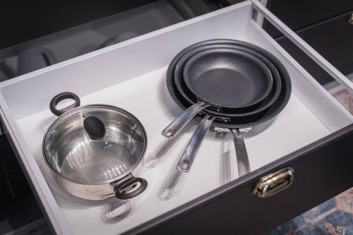 two pots and pans are sitting on a drawer at NYC Loft Inspired •12 mins to WEM •Vintage arcade in Edmonton