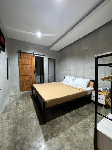 a bedroom with a bed in a room at HappyNest Hostel Cebu in Cebu City