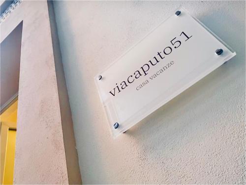 a sign on the side of a wall with the word vyssride at Via Caputo 51 in Grottaglie