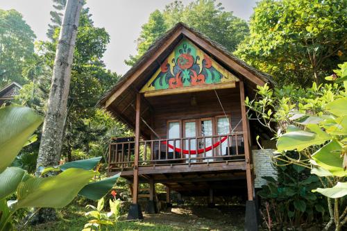 a tree house in the forest at Casa Nemo Beach Resort & Spa in Sabong