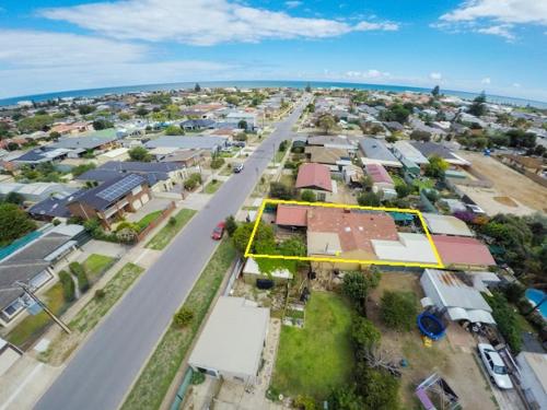 an aerial view of a town with a yellow street at Cottage by the Sea in Port Adelaide