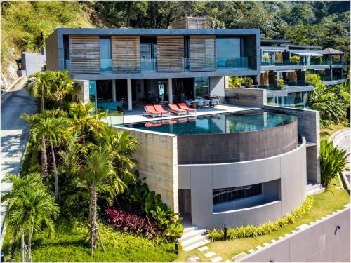 an aerial view of a house with a swimming pool at The Cube Ocean View Pool Villa Kalim in Patong Beach