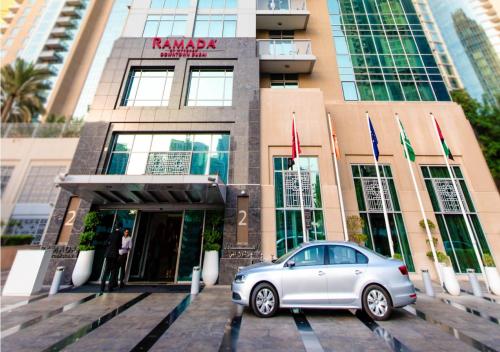 a silver car parked in front of a building at Ramada Downtown Dubai in Dubai
